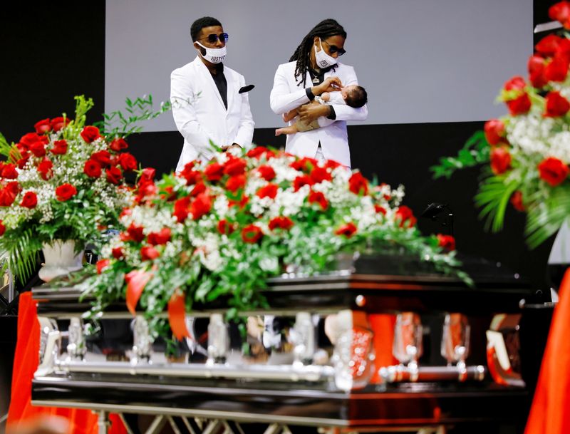 Andrew Brown Jr.’s sons and grandson behind his coffin during
