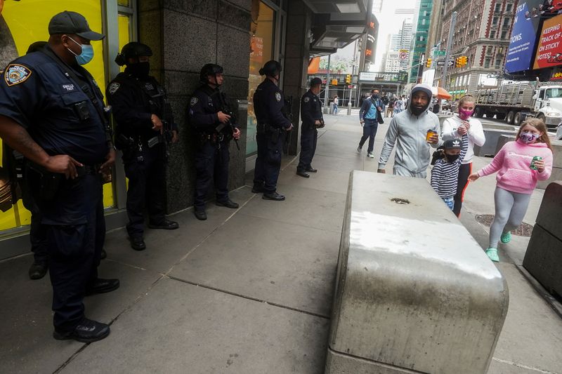 FILE PHOTO: New York City police officers stand in Times