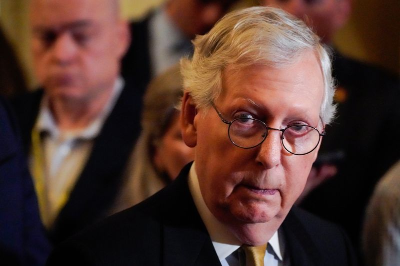 Senate Minority Leader Mitch McConnell speaks to reporters following a