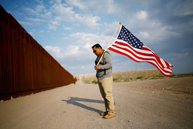 FILE PHOTO: Military veterans walk on the border between the