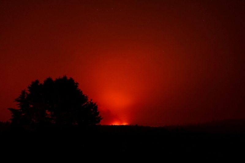 FILE PHOTO: The Bootleg Fire glows in the distance, near