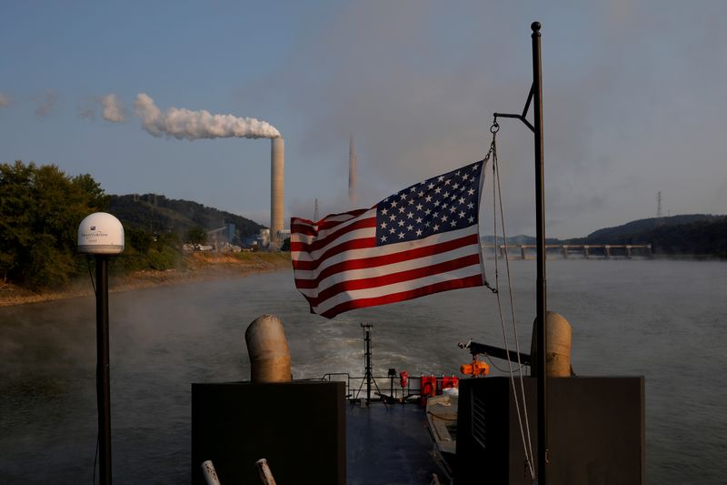 FILE PHOTO: The U.S. flag flies on a towboat as