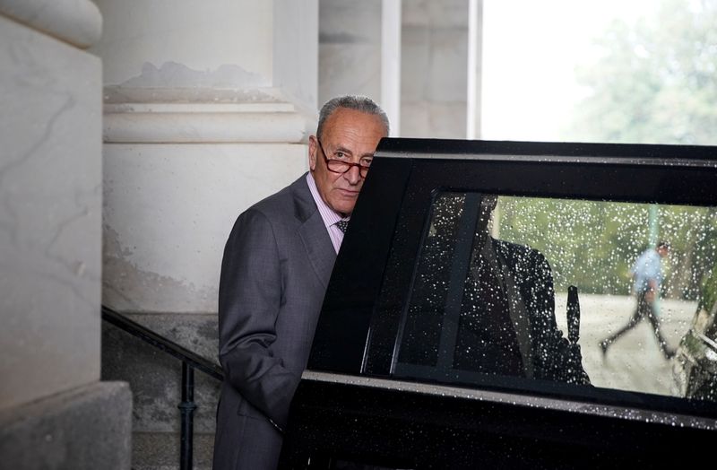 FILE PHOTO: U.S. Senate Majority Leader Chuck Schumer departs