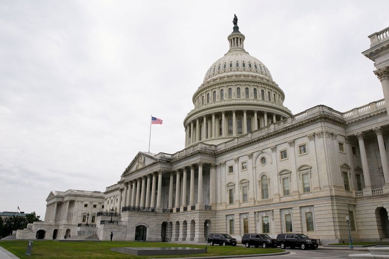 FILE PHOTO: Vehicles are parked outside the U.S. Capitol building