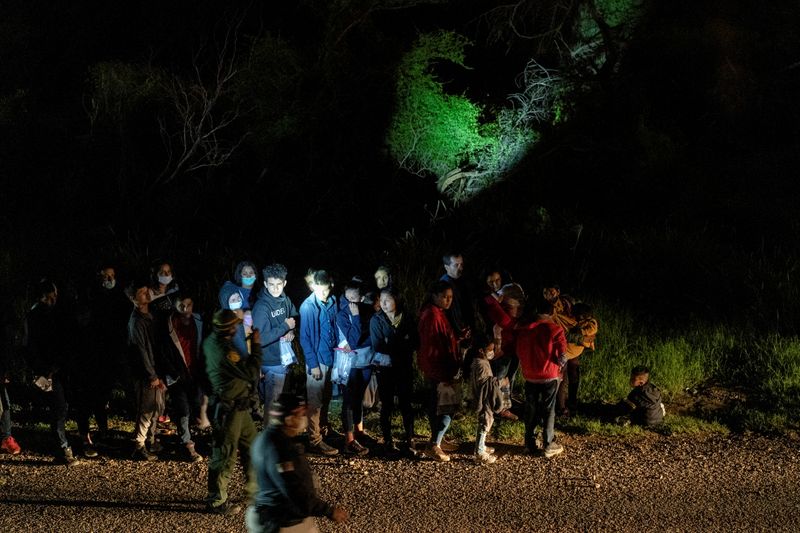 Asylum-seeking migrants cross Rio Grande river into U.S. in Roma