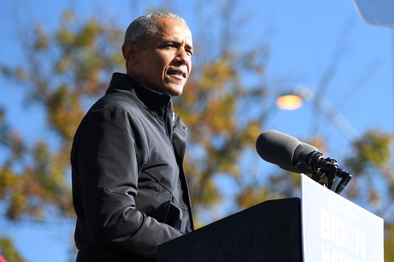 Former President Barack Obama addresses voters one day before the