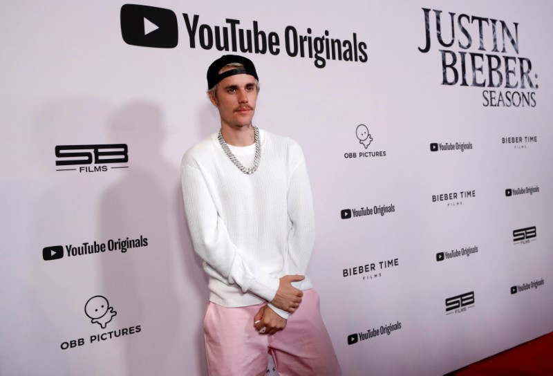 Singer Bieber poses at the premiere for the documentary television