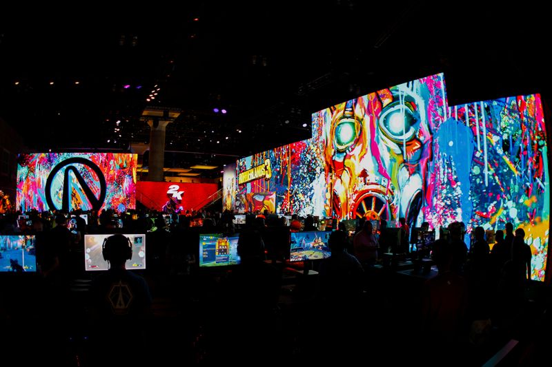 Gamers play video games at E3, the annual video games