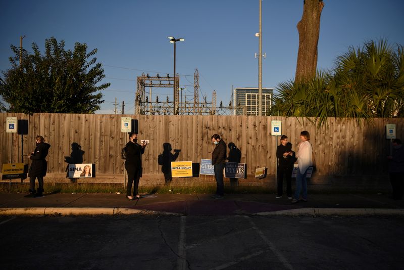 Voters line up at a polling station during Election Day