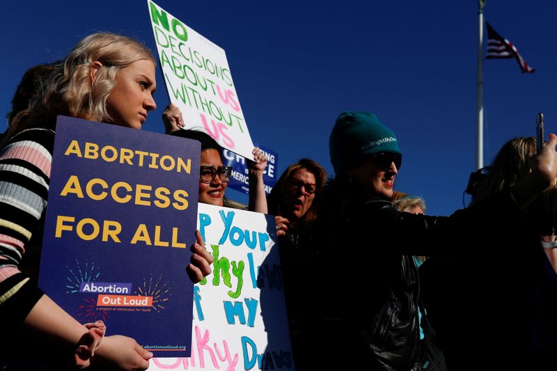 FILE PHOTO: U.S. Supreme Court justices hear a major abortion