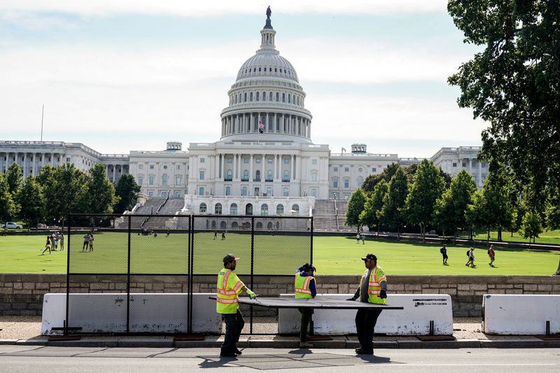 FILE PHOTO: Fencing is being removed from the US Capitol