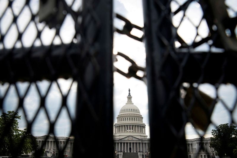 FILE PHOTO: A security fence surrounds the U.S. Capitol in