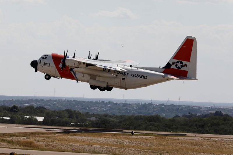 A U.S. Coast Guard airplane with migrants on board departs