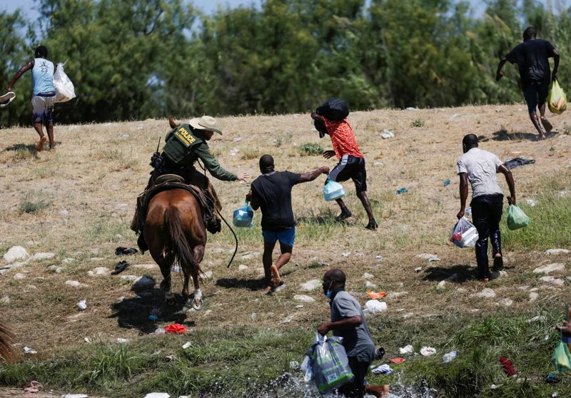 Migrants collecting food try to evade law enforcement at the