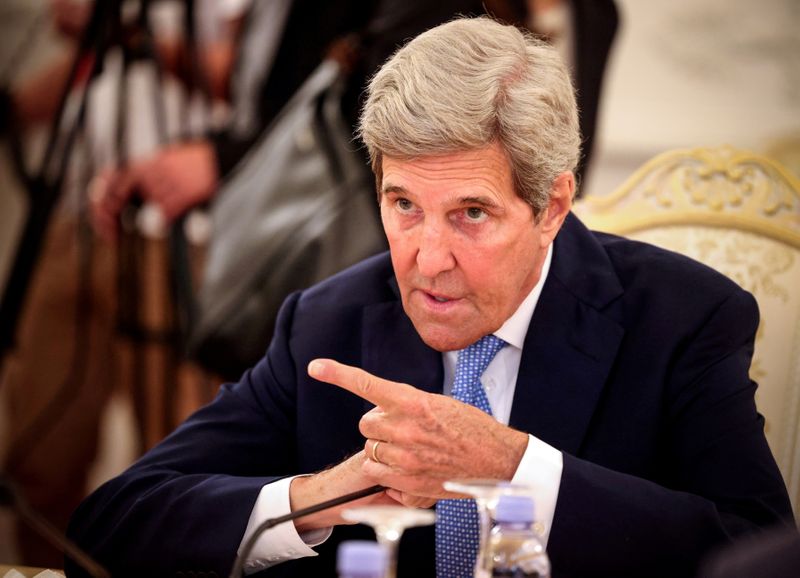 FILE PHOTO: U.S. climate envoy Kerry gestures during a meeting