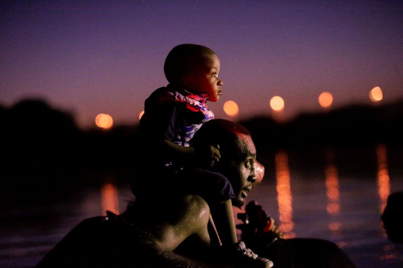 Migrants seeking refuge in the U.S. cross the Rio Grande