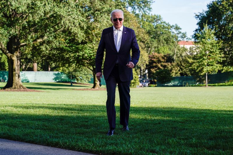 U.S. President Joe Biden walks from Marine One as he