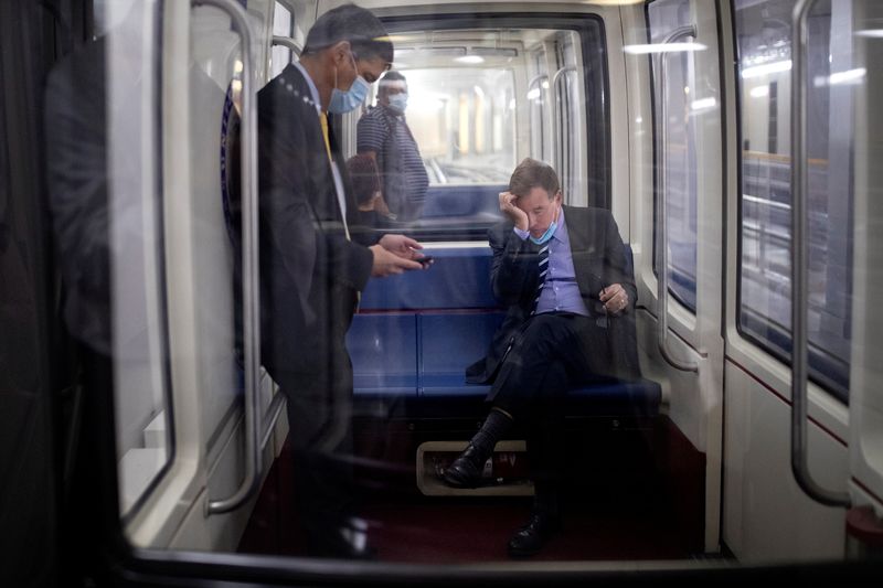 Senator Warner rides the Senate Subway following a vote on