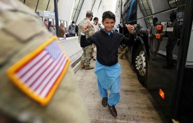 Afghan refugees arrive at Dulles Airport in Virginia