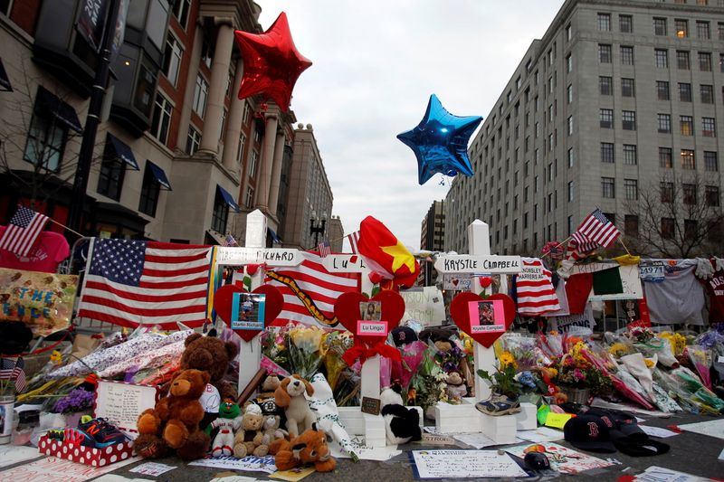 FILE PHOTO: Crosses for each of the three people killed