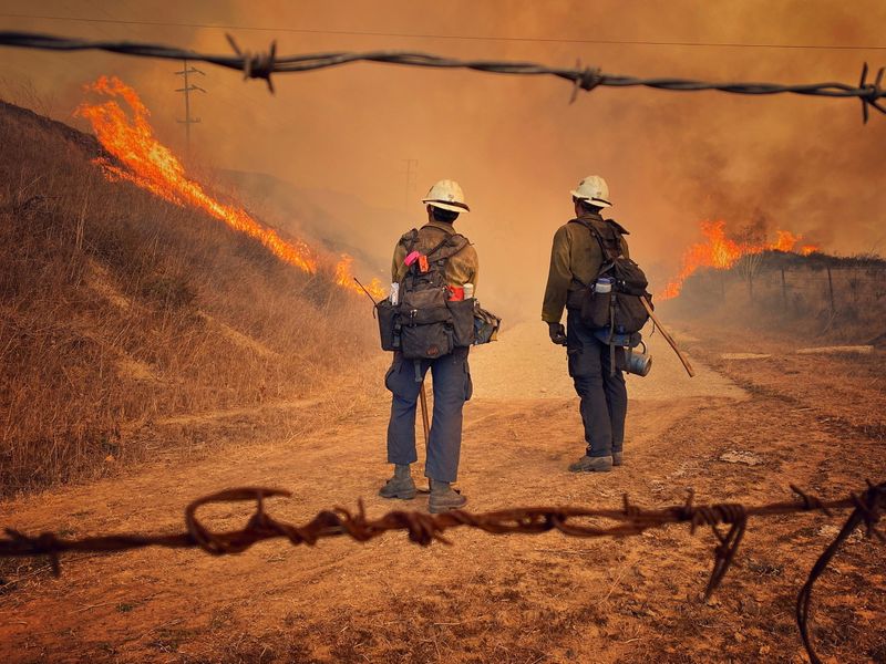 Santa Barbara County Fire Hand Crew members burn off pockets