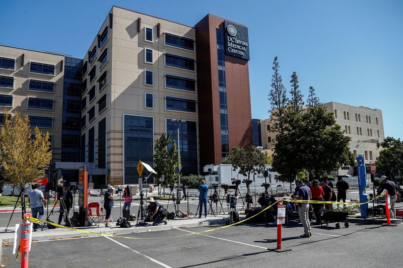 Members of media wait outside University of California Irvine Medical