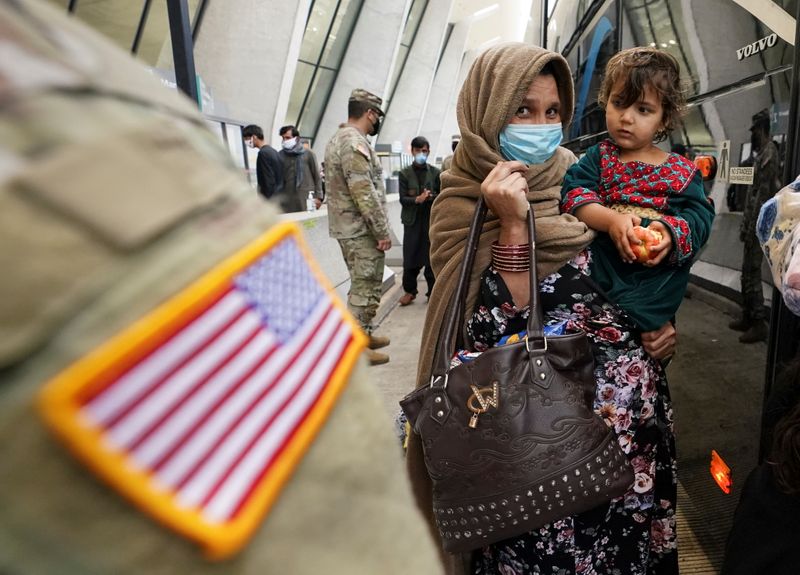 FILE PHOTO: Afghan refugees arrive at Dulles Airport in Virginia