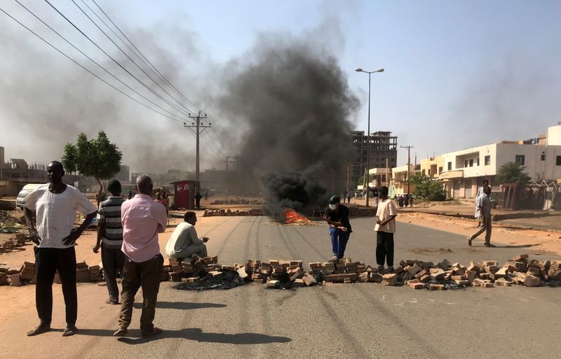 Protesters block a road in Khartoum