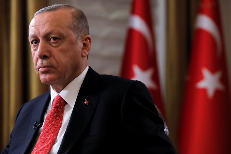 Turkish President Tayyip Erdogan sits during an interview with Reuters