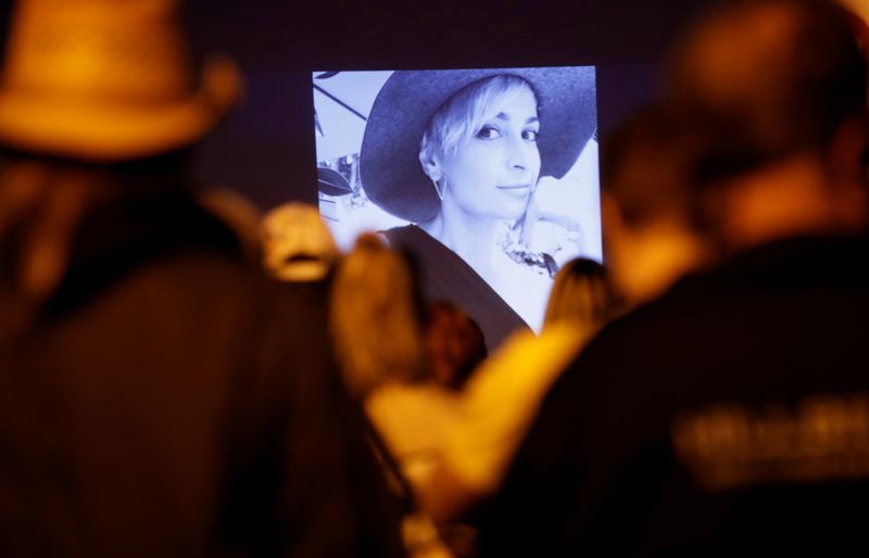 FILE PHOTO: People attend a vigil for cinematographer Halyna Hutchins,