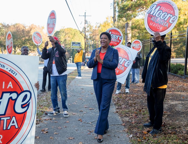 Atlanta mayoral candidates campaign and vote on Election Day