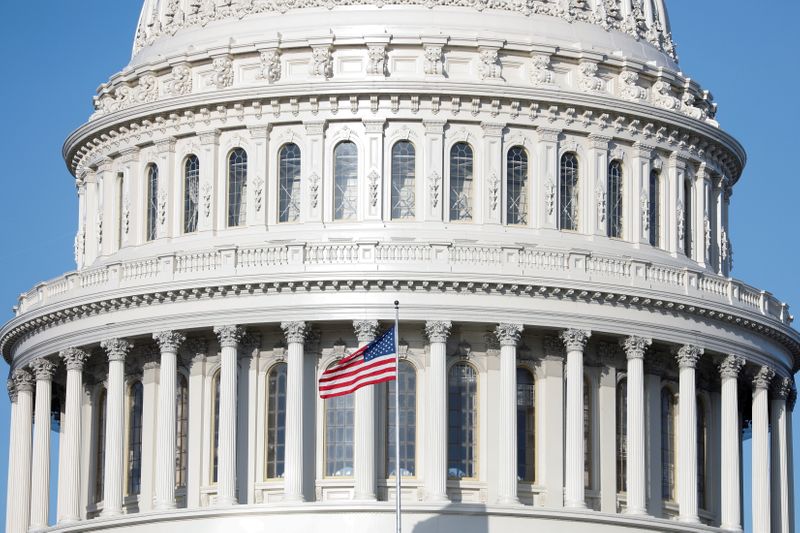 FILE PHOTO: The American Flag flies at the U.S. Capitol
