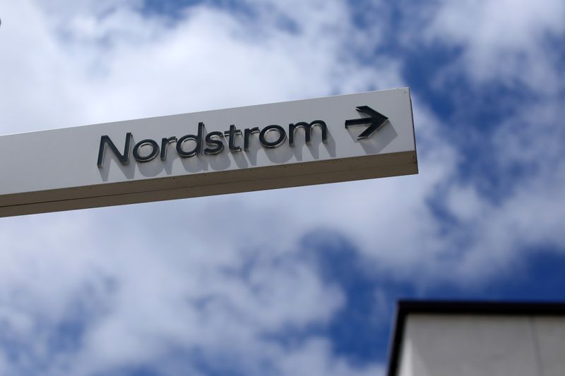 A sign directs shoppers to a Nordstrom store at a