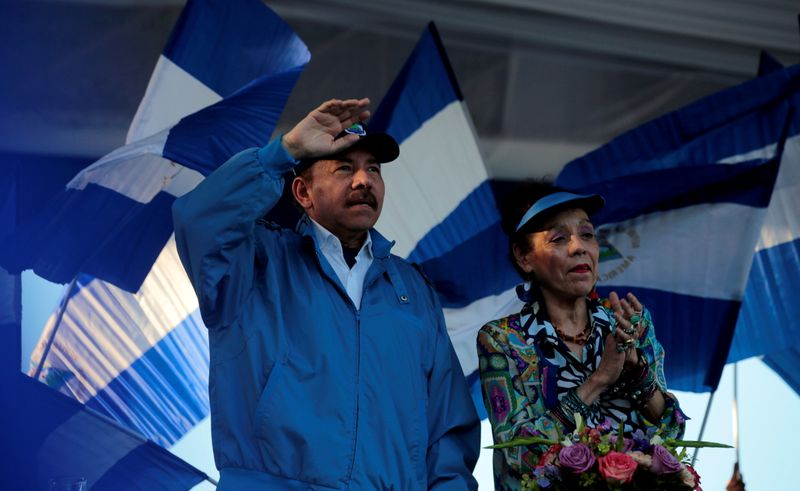 FILE PHOTO: Nicaraguan President Ortega and Vice President Murillo gesture