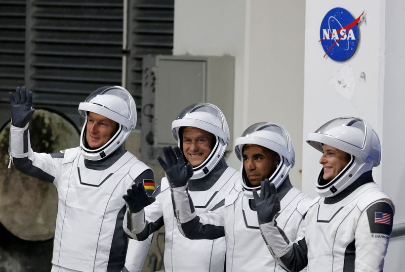 FILE PHOTO: NASA astronauts depart their crew quarters for launch