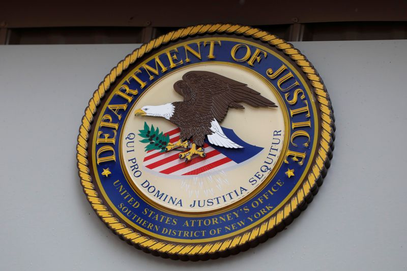 The seal of the United States Department of Justice is