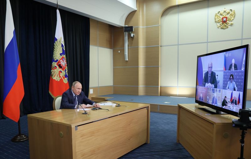 Russian President Vladimir Putin chairs a meeting via a video