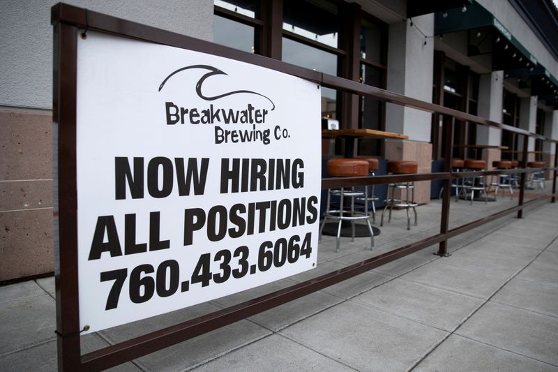 FILE PHOTO: A restaurant advertising jobs looks to attract workers