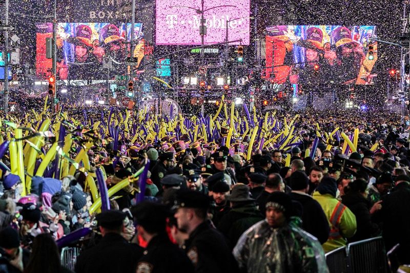 FILE PHOTO: Revelers celebrate New Year’s Eve in Times Square