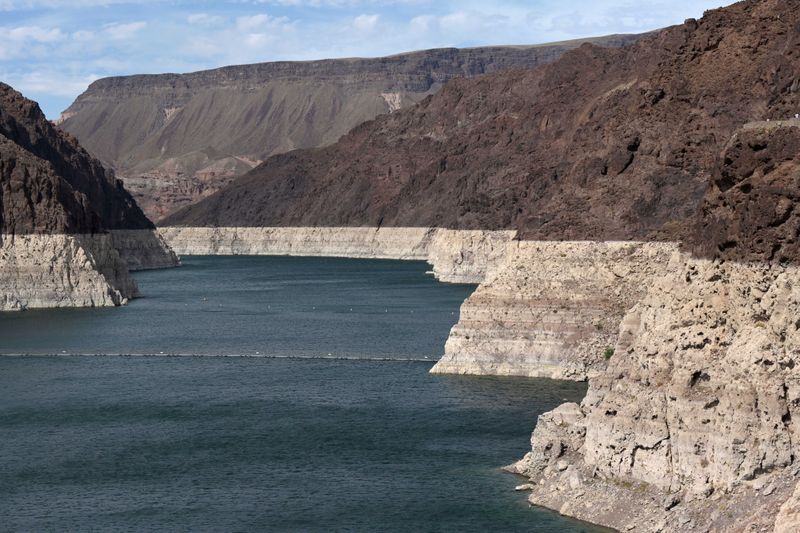 Hoover Dam reservoir sinks to record low, in sign of