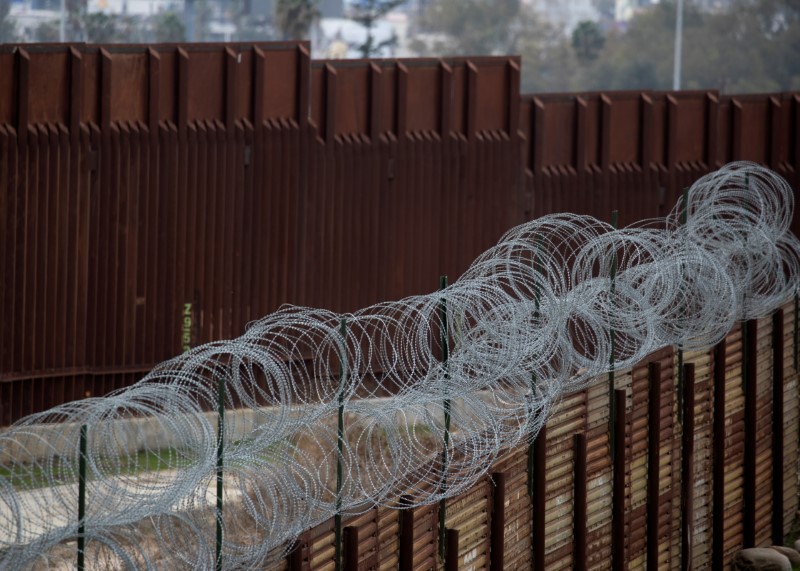 FILE PHOTO: An old border wall fence is shown next