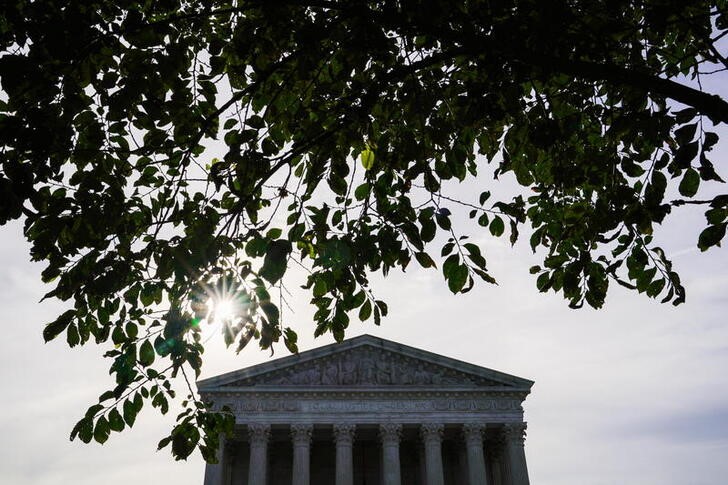FILE PHOTO: The sun rises behind the U.S. Supreme Court
