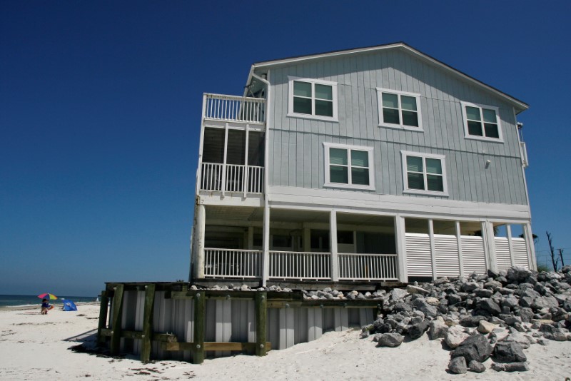 FILE PHOTO: A retaining wall supports a beach house on