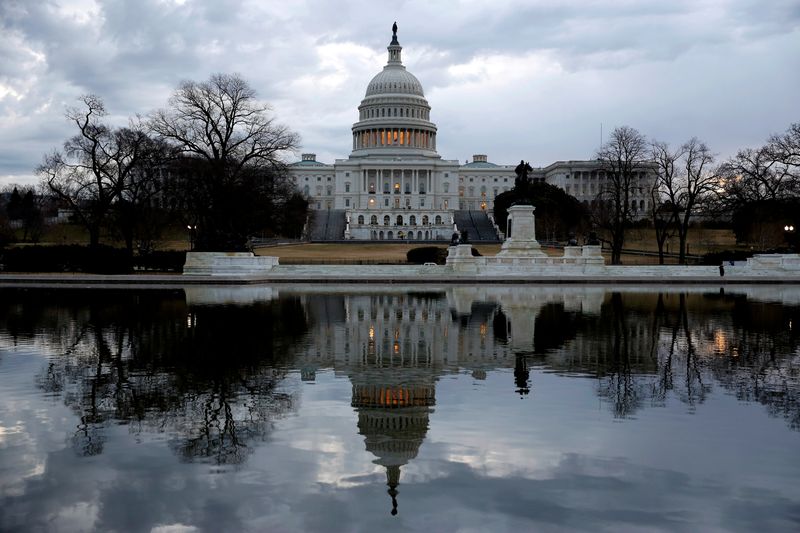 FILE PHOTO: Clouds pass over the U.S. Capitol at the
