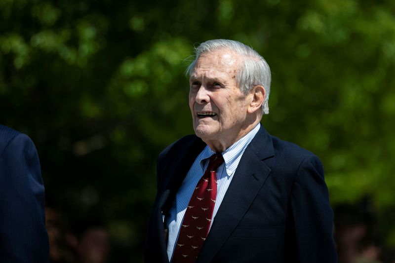 Former U.S. President George W. Bush places a wreath as