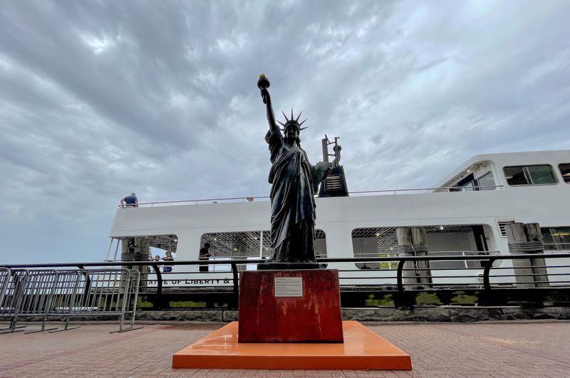 A replica Statue of Liberty is installed on Ellis Island