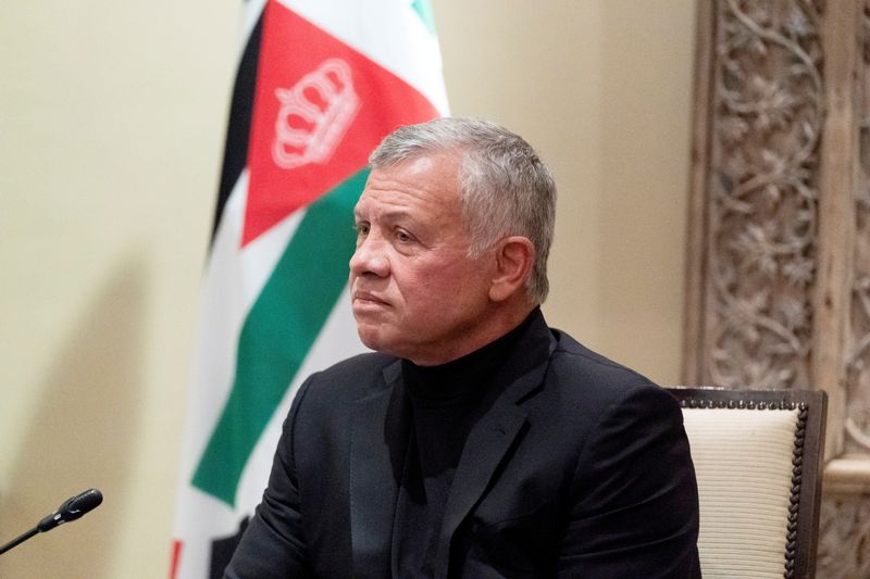 FILE PHOTO: Jordan’s King Abdullah II listens during a meeting