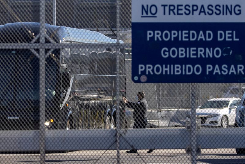 FILE PHOTO: A bus leaves a closed border facility in