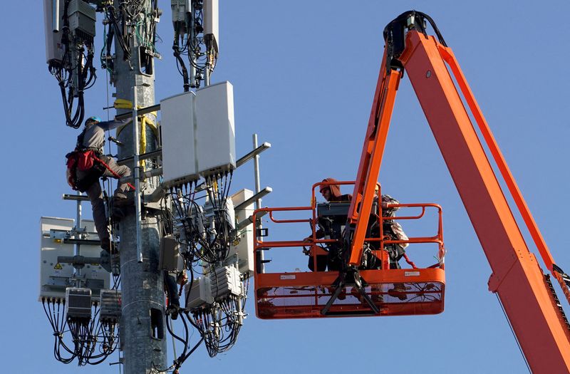 FILE PHOTO: A contract crew from Verizon installs 5G equipment