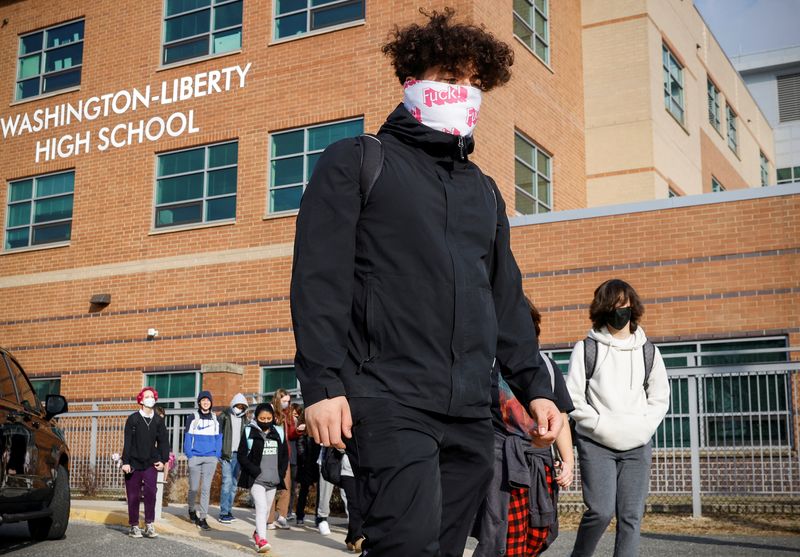 Students leave Washington-Liberty High School in Arlington, Virginia